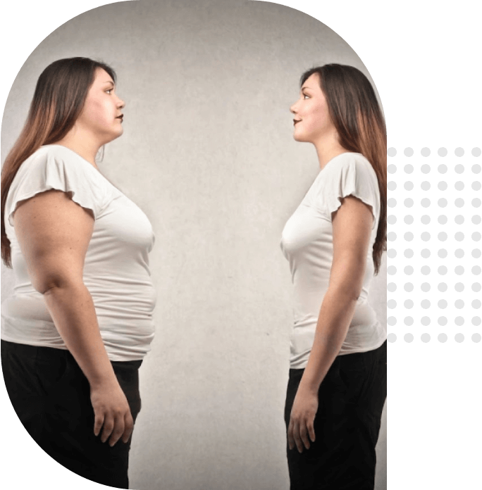 A woman is standing in front of a mirror.